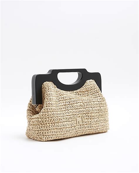 Beige raffia clutch bag .